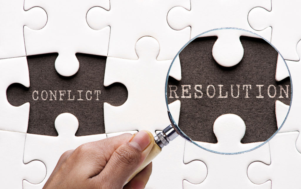 Magnifying glass searching missing puzzle peaces "Resolution"